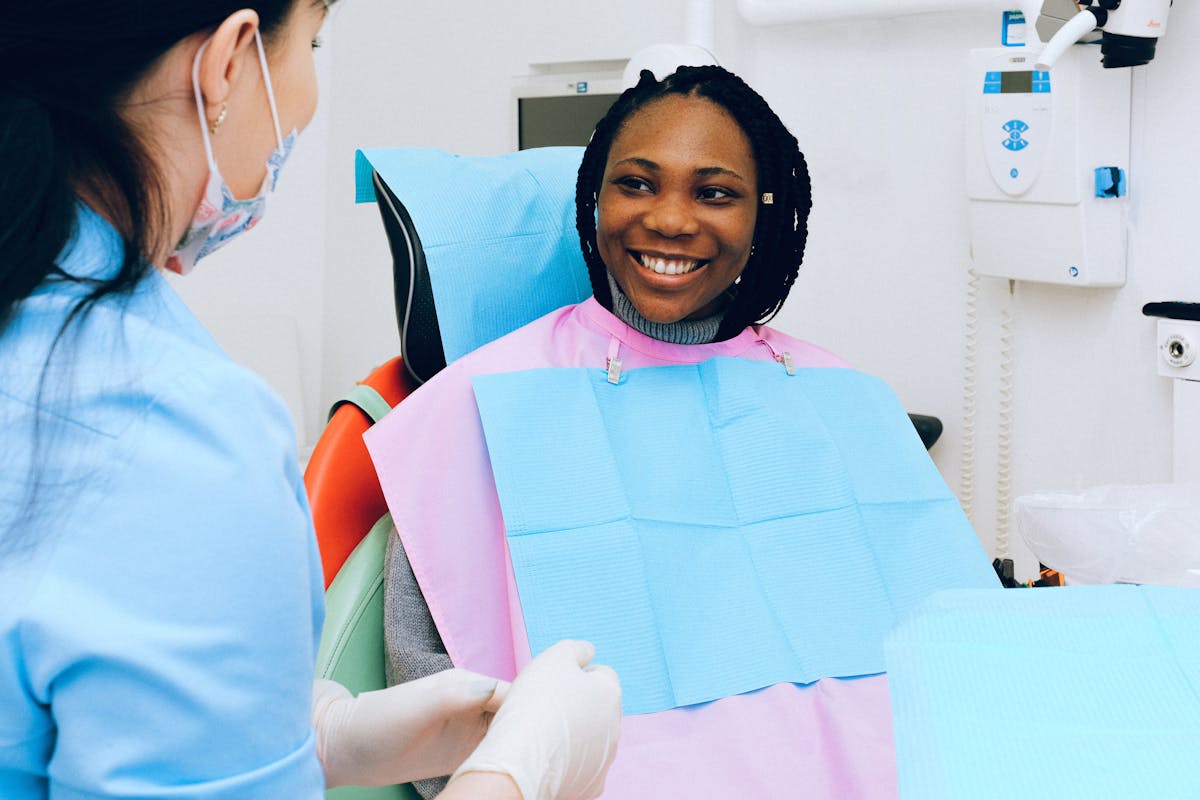A child smiling during a friendly dental check-up